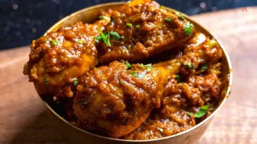 Authentic Indian chicken curry with rich spicy gravy served in a bowl, restaurant style dish